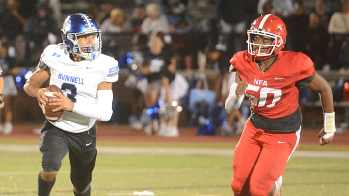 NFA lineman Jasiyah Succes (50) forces Bunnell quarterback Steven Mendoza from the pocket.