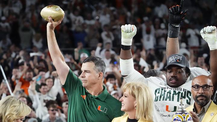 Miami Hurricanes head coach Mario Cristobal lifts the trophy after defeating Ole Miss 31-27 in the Vrbo Fiesta Bowl and CFP semifinal game at State Farm Stadium on Jan. 8, 2026, in Glendale. Miami Hurricanes head coach Mario Cristobal lifts the trophy after defeating Ole Miss 31-27 in the Vrbo Fiesta Bowl and CFP semifinal game at State Farm Stadium on Jan. 8, 2026, in Glendale.