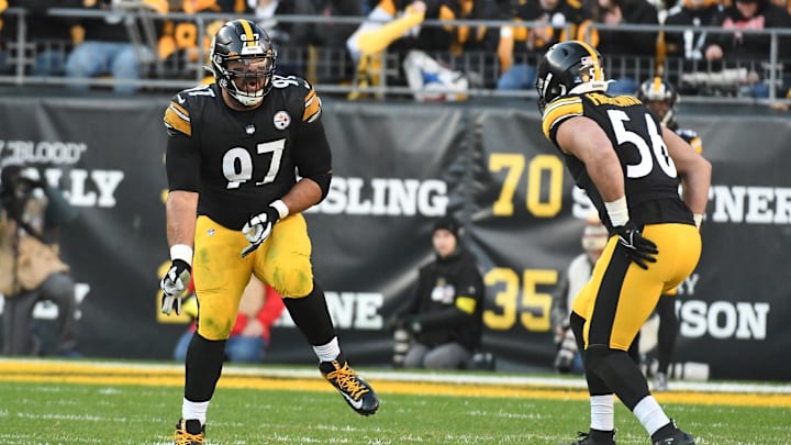 Jan 8, 2023; Pittsburgh, Pennsylvania, USA;  Pittsburgh Steelers defensive Cameron Heyward (97) celebrates a sack with Alex Highsmith (56) during the fourth quarter in a game against the Cleveland Browns at Acrisure Stadium. Heyward was flagged for a roughing the passer on the play. Mandatory Credit: Philip G. Pavely-Imagn Images