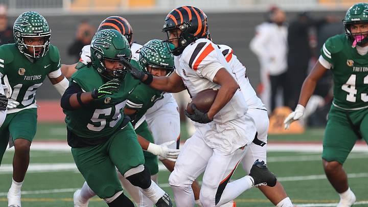 Brandon Smith with some tough running during the first half of the CIF Division 1-A championship game for Central East versus Oxnard Pacifica