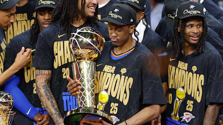 Jun 22, 2025; Oklahoma City, Oklahoma, USA; Oklahoma City Thunder forward Jalen Williams (8) holds the NBA Larry O'Brien Championship Trophy at the end of game seven of the 2025 NBA Finals after defeating the Indiana Pacers at Paycom Center. Mandatory Credit: Alonzo Adams-Imagn Images