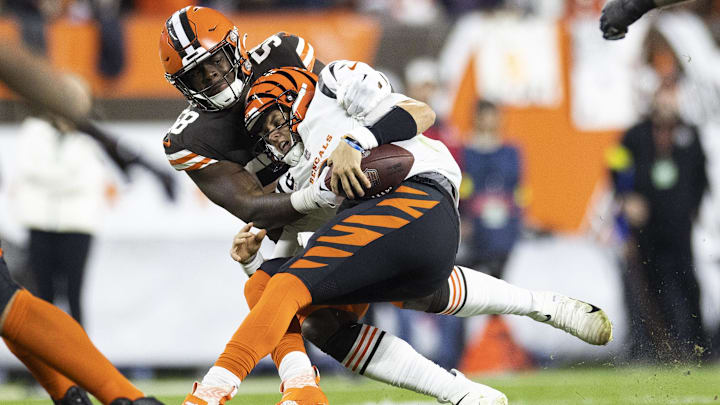 Oct 31, 2022; Cleveland, Ohio, USA; Cleveland Browns defensive end Isaiah Thomas (58) sacks Cincinnati Bengals quarterback Joe Burrow (9) during the second quarter at FirstEnergy Stadium. Oct 31, 2022; Cleveland, Ohio, USA; Cleveland Browns defensive end Isaiah Thomas (58) sacks Cincinnati Bengals quarterback Joe Burrow (9) during the second quarter at FirstEnergy Stadium.