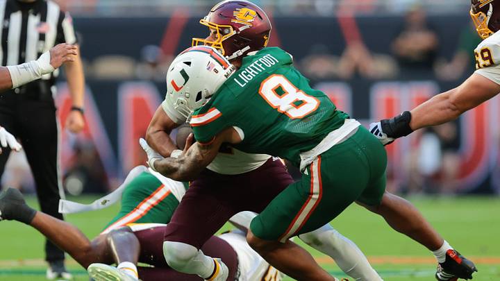 Sep 26, 2026; Miami Gardens, Florida, USA; Miami Hurricanes defensive lineman Marquise Lightfoot (8) sacks Central Michigan Chippewas quarterback Angel Flores (7) during the first quarter at Hard Rock Stadium. Mandatory Credit: Sam Navarro-Imagn Images Sep 26, 2026; Miami Gardens, Florida, USA; Miami Hurricanes defensive lineman Marquise Lightfoot (8) sacks Central Michigan Chippewas quarterback Angel Flores (7) during the first quarter at Hard Rock Stadium. Mandatory Credit: Sam Navarro-Imagn Images