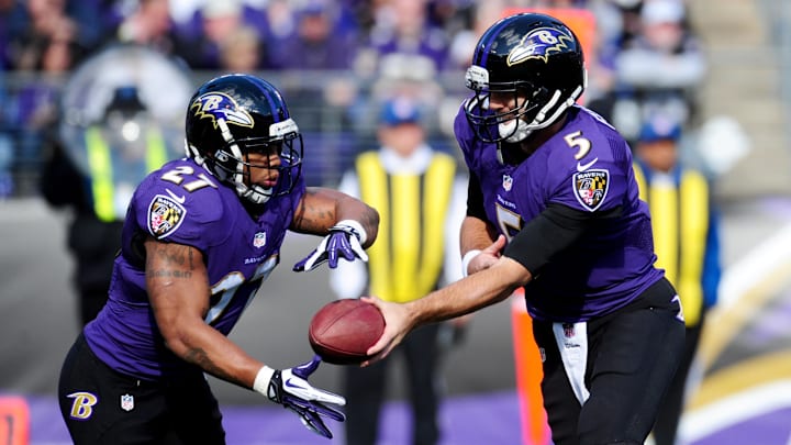 Nov 10, 2013; Baltimore, MD, USA; Baltimore Ravens quarterback Joe Flacco (5) hands the ball off to running back Ray Rice (27) during the game against the Cincinnati Bengals at M&T Bank Stadium. Mandatory Credit: Evan Habeeb-Imagn Images