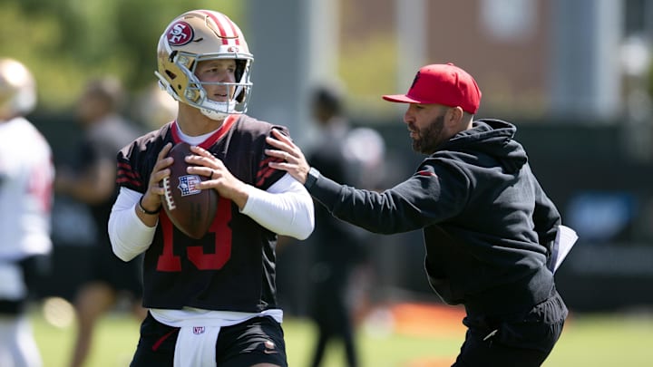Jun 11, 2025; Santa Clara, CA, USA; San Francisco 49ers quarterbacks coach harasses Brock Purdy (13) in a passing drill during a team OTA at Levi's Stadium. Mandatory Credit: D. Ross Cameron-Imagn Images