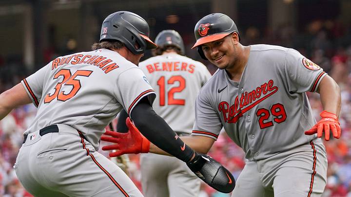 Baltimore Orioles catcher Samuel Bassallo (29) and designated hitter Adley Rutschman (35) celebrate after Bassallo scores a homer in the third inning of a MLB game between the Cincinnati Reds and Baltimore Orioles, Friday, July 3, 2026, at Great American Ball Park in downtown Cincinnati.