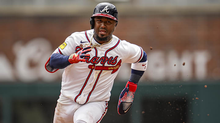 Atlanta Braves second baseman Ozzie Albies (1) runs to third base against the Kansas City Royals during the fifth inning at Truist Park. Mandatory Credit: Dale Zanine-Imagn Images