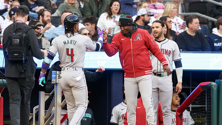 Apr 6, 2024;  Arizona Diamondbacks second baseman Ketel Marte (4) celebrates with shortstop Geraldo Perdomo (2) after a home run against the Atlanta Braves