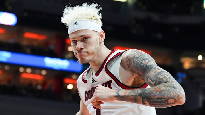Louisville Cardinals forward Kasean Pryor (7) flexes after a first half slam dunk against Spalding University in the Cards' second exhibition game at the KFC Yum! Center in Louisville, Kentucky Monday, Oct. 28, 2024.