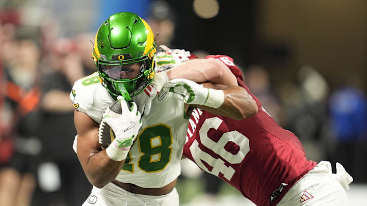 Jan 9, 2026; Atlanta, GA, USA; Oregon Ducks tight end Kenyon Sadiq (18) runs against Indiana Hoosiers linebacker Isaiah Jones (46)during the first quarter of the 2025 Peach Bowl and semifinal game of the College Football Playoff at Mercedes-Benz Stadium. Mandatory Credit: Dale Zanine-Imagn Images