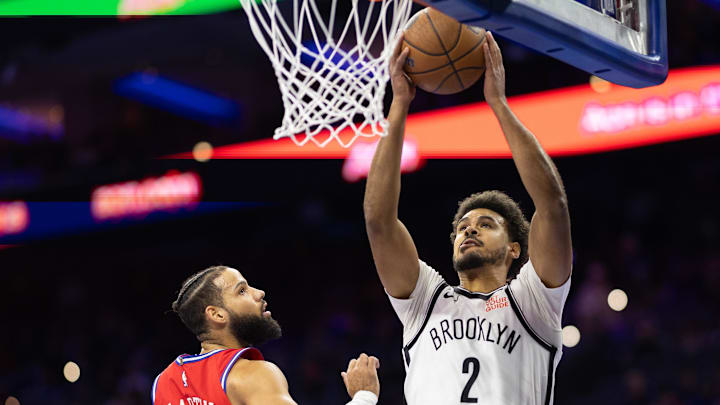 Nov 22, 2024; Philadelphia, Pennsylvania, USA; Brooklyn Nets forward Cameron Johnson (2) drives for a shot past Philadelphia 76ers forward Caleb Martin (16) during the first quarter at Wells Fargo Center. Mandatory Credit: Bill Streicher-Imagn Images