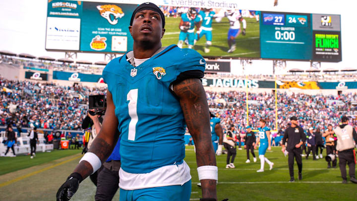 Jacksonville Jaguars running back Travis Etienne Jr. (1) walks off the field after losing to the Bills during an NFL football AFC Wild Card playoff matchup, Sunday, Jan. 11, 2026, in Jacksonville, Fla. Bills lead 10-7 at the half over the Jaguars. The Bills defeated the Jaguars 27-24. [Doug Engle/Florida Times-Union]