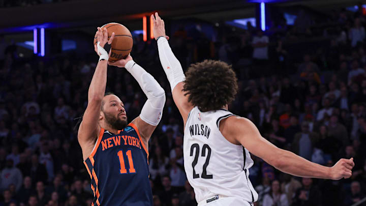 Apr 12, 2024; New York, New York, USA; New York Knicks guard Jalen Brunson (11) shoots the ball against Brooklyn Nets forward Jalen Wilson (22) during the second half at Madison Square Garden. Mandatory Credit: Vincent Carchietta-Imagn Images