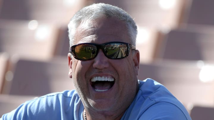 Former NFL head coach Rex Ryan laughing