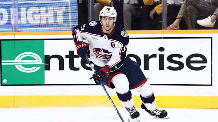 Oct 26, 2024; Nashville, Tennessee, USA; Columbus Blue Jackets right wing Yegor Chinakhov (59) brings the puck around the board in the second period against the Nashville Predators at Bridgestone Arena. Mandatory Credit: Casey Gower-Imagn Images