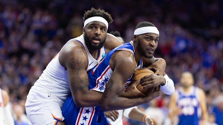 May 2, 2024; Philadelphia, Pennsylvania, USA; New York Knicks center Mitchell Robinson (23) and Philadelphia 76ers forward Paul Reed (44) wrestle for the ball during the second half of game six of the first round for the 2024 NBA playoffs at Wells Fargo Center. Mandatory Credit: Bill Streicher-Imagn Images
