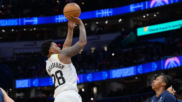 Mar 5, 2025; Washington, District of Columbia, USA; Utah Jazz forward Brice Sensabaugh (28) takes a jump shot over Washington Wizards guard Bub Carrington (8) during the fourth quarter at Capital One Arena. Mandatory Credit: Reggie Hildred-Imagn Images
