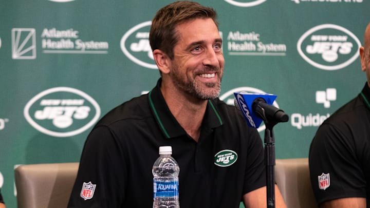 Apr 26, 2023; Florham Park, NJ, USA; New York Jets quarterback Aaron Rodgers (8) smiles during the introductory press conference at Atlantic Health Jets Training Center. Mandatory Credit: Tom Horak-Imagn Images
