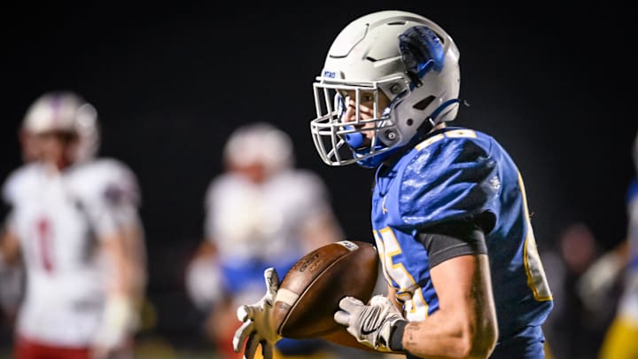 Mukwonago tight end Luka Tess (85) pulls in a 24-yard touchdown reception against Arrowhead during the third quarter in a playoff game Friday, November 8, 2024, at Mukwonago High School in Mukwonago, Wisconsin. Mukwonago tight end Luka Tess (85) pulls in a 24-yard touchdown reception against Arrowhead during the third quarter in a playoff game Friday, November 8, 2024, at Mukwonago High School in Mukwonago, Wisconsin.