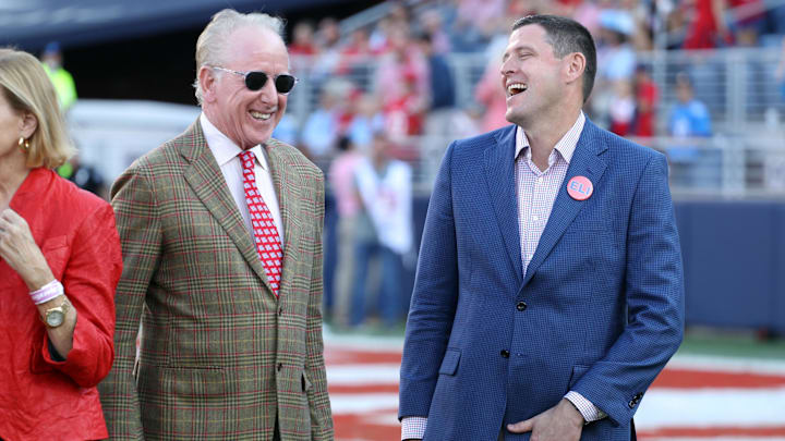 Oct 23, 2021; Oxford, Mississippi, USA; Mississippi Rebels former quarterback Archie Manning talks with Mississippi Rebels athletic director Keith Carter during half time at Vaught-Hemingway Stadium. Mandatory Credit: Petre Thomas-Imagn Images