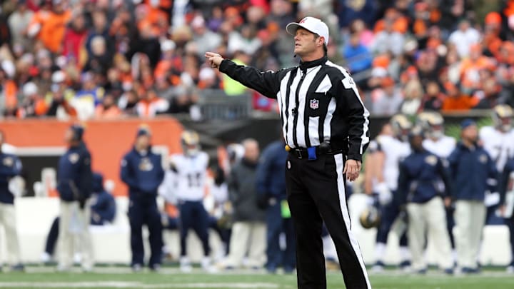 Nov 29, 2015; Cincinnati, OH, USA; NFL referee Craig Wrolstad (4) signals during the game of the St. Louis Rams against the Cincinnati Bengals at Paul Brown Stadium. The Bengals won 31-7. Mandatory Credit: Aaron Doster-Imagn Images