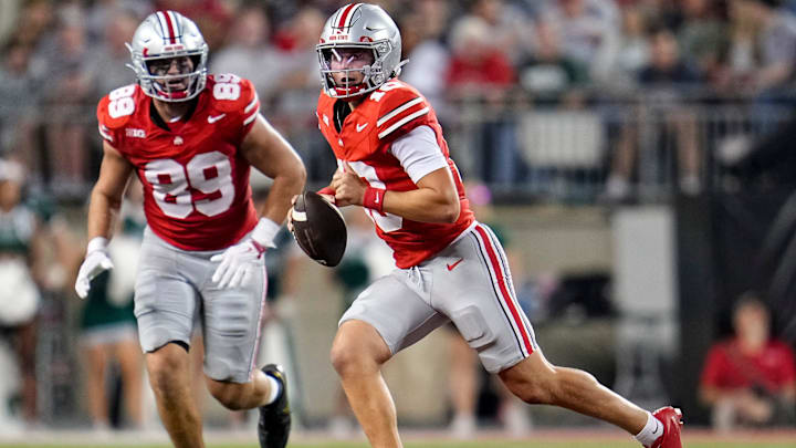 Ohio State Buckeyes quarterback Julian Sayin (10) scrambles in front of tight end Will Kacmarek (89) during the NCAA football game against the Ohio Bobcats at Ohio Stadium on Sept. 13, 2025. Ohio State won 37-9.