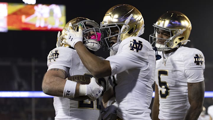 Nov 29, 2025; Stanford, California, USA;  Notre Dame Fighting Irish running back Aneyas Williams (22) celebrates with Notre Dame Fighting Irish tight end Ty Washington (7) after scoring a touchdown during the fourth quarter against the Stanford Cardinal at Stanford Stadium. 