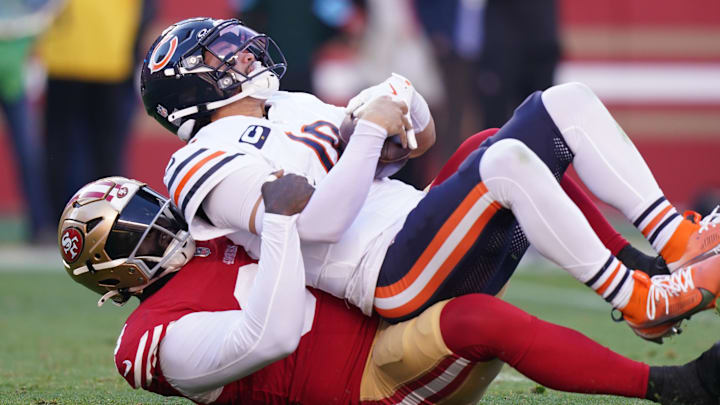 Dec 8, 2024; Santa Clara, California, USA; Chicago Bears quarterback Caleb Williams (18) is sacked by San Francisco 49ers defensive tackle Maliek Collins (99) in the second quarter at Levi's Stadium. Mandatory Credit: Cary Edmondson-Imagn Images