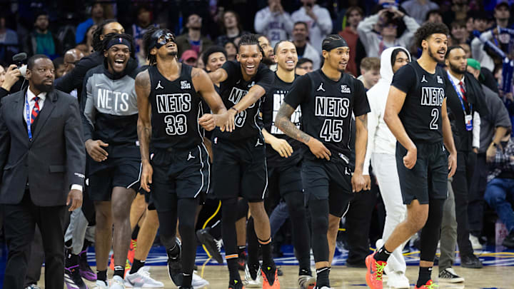 Feb 22, 2025; Philadelphia, Pennsylvania, USA; Brooklyn Nets center Nic Claxton (33) celebrates with teammates after hitting a game winning shot against the Philadelphia 76ers as time expired in fourth quarter at Wells Fargo Center. Mandatory Credit: Bill Streicher-Imagn Images