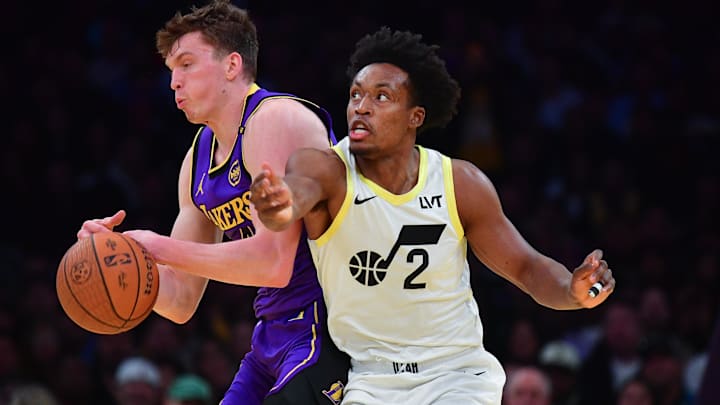 Los Angeles Lakers guard Dalton Knecht (4) plays for the ball against Utah Jazz guard Collin Sexton (2) during the first half at Crypto.com Arena.