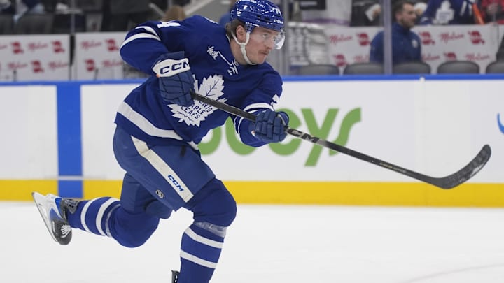 Jan 27, 2026; Toronto, Ontario, CAN; Toronto Maple Leafs forward Bobby McMann (74) shoots the puck during warm up before a game against the Buffalo Sabres at Scotiabank Arena. Mandatory Credit: John E. Sokolowski-Imagn Images