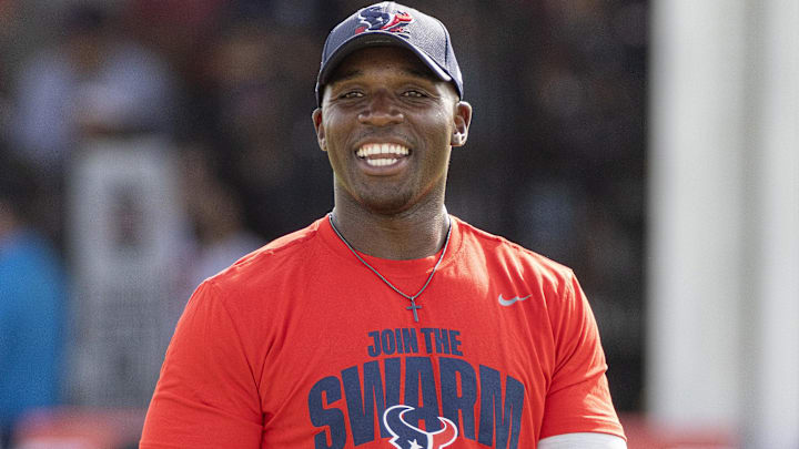 Houston Texans head coach DeMeco Ryans watches players warm up during training camp practice at the Houston Methodist Training Center.