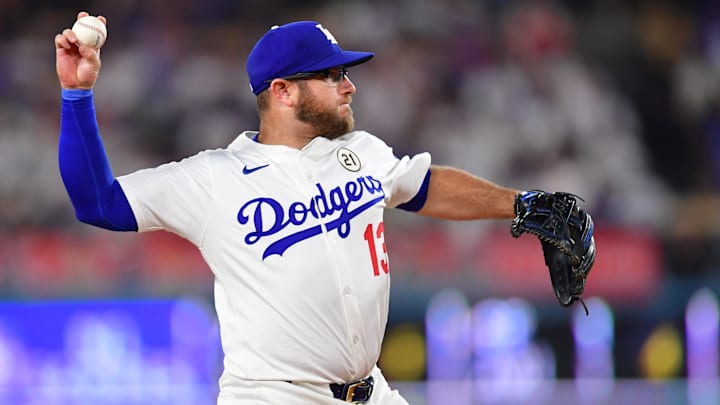 Sep 15, 2025; Los Angeles, California, USA; Los Angeles Dodgers third base Max Muncy (13) makes a throw to first base against the Philadelphia Phillies in the first inning at Dodger Stadium. Mandatory Credit: Gary A. Vasquez-Imagn Images