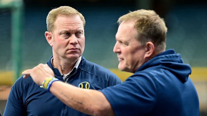 Oct 2, 2024; Milwaukee, Wisconsin, USA; Milwaukee Brewers general manager Matt Arnold talks to manager Matt Arnold before game two of the Wildcard round for the 2024 MLB Playoffs against the New York Mets at American Family Field. Mandatory Credit: Benny Sieu-Imagn Images