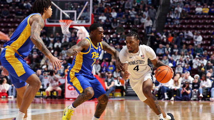 Penn State Nittany Lions guard Kayden Mingo (4) dribbles the ball around Pittsburgh Panthers guard Damarco Minor (7) during the first half at Giant Center. Penn State Nittany Lions guard Kayden Mingo (4) dribbles the ball around Pittsburgh Panthers guard Damarco Minor (7) during the first half at Giant Center.