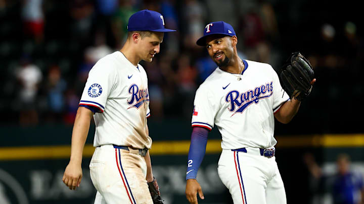 Texas Rangers shortstop Corey Seager (5) celebrates with Texas Rangers second baseman Marcus Semien (2) after the game against the Athletics at Globe Life Field. Texas Rangers shortstop Corey Seager (5) celebrates with Texas Rangers second baseman Marcus Semien (2) after the game against the Athletics at Globe Life Field.