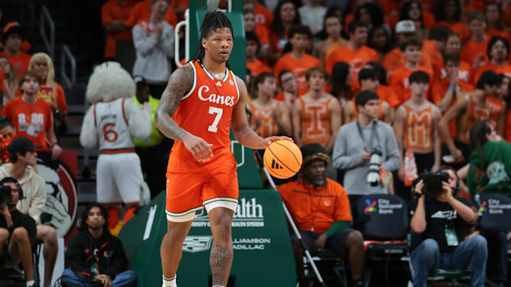 Feb 10, 2026; Coral Gables, Florida, USA; Miami Hurricanes forward Shelton Henderson (7) dribbles the basketball against the North Carolina Tar Heels during the first half at Watsco Center. Mandatory Credit: Sam Navarro-Imagn Images