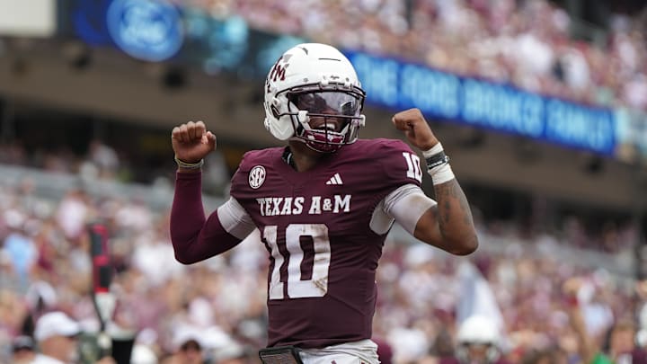 Texas A&M Aggies quarterback Marcel Reed celebrates after a touchdown pass during the second quarter against the Utah State Aggies at Kyle Field. Texas A&M Aggies quarterback Marcel Reed celebrates after a touchdown pass during the second quarter against the Utah State Aggies at Kyle Field.
