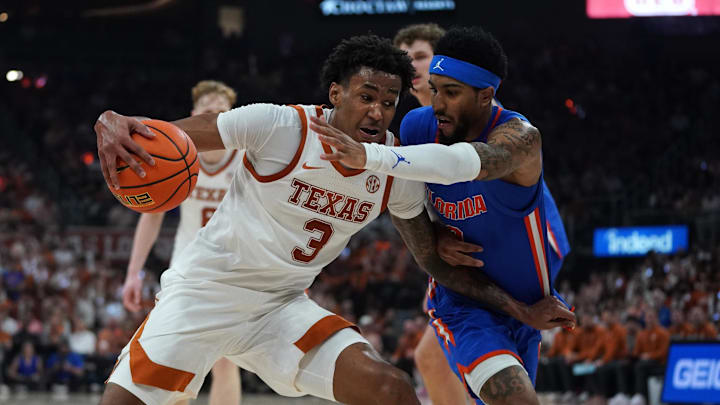 Texas Longhorns guard Dailyn Swain drives the ball to the hoop against Florida Gators guard Boogie Fland during the first half at Moody Center. 