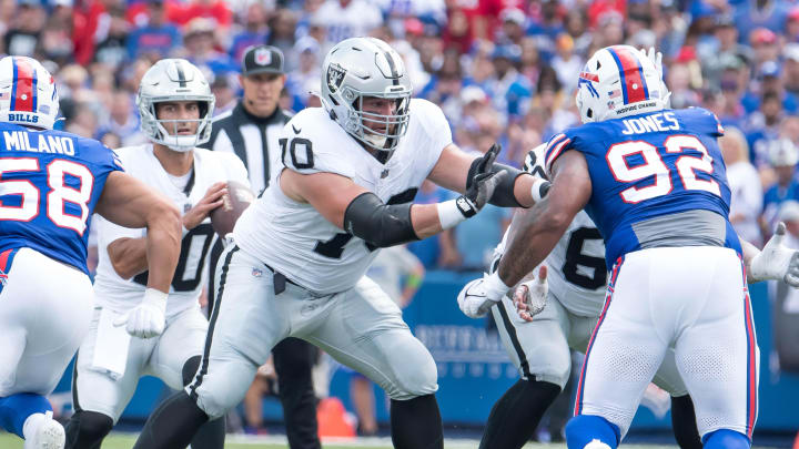 Sep 17, 2023; Orchard Park, New York, USA; Las Vegas Raiders guard Greg Van Roten (70) blocks Buffalo Bills defensive tackle DaQuan Jones (92) for quarterback Jimmy Garoppolo (10) in the second quarter at Highmark Stadium. Mandatory Credit: Mark Konezny-USA TODAY Sports