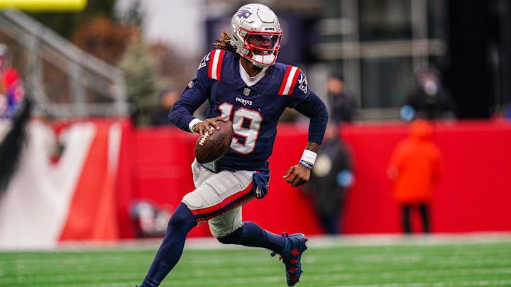 Jan 5, 2025; Foxborough, Massachusetts, USA; New England Patriots quarterback Joe Milton III (19) runs the ball against the Buffalo Bills in the first half at Gillette Stadium. Mandatory Credit: David Butler II-Imagn Images