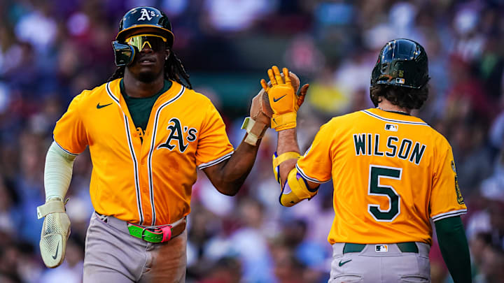 Sep 18, 2025; Boston, Massachusetts, USA; Athletics outfielder Lawrence Butler (4) is congratulated after scoring against the Boston Red Sox in the seventh inning at Fenway Park. Mandatory Credit: David Butler II-Imagn Images