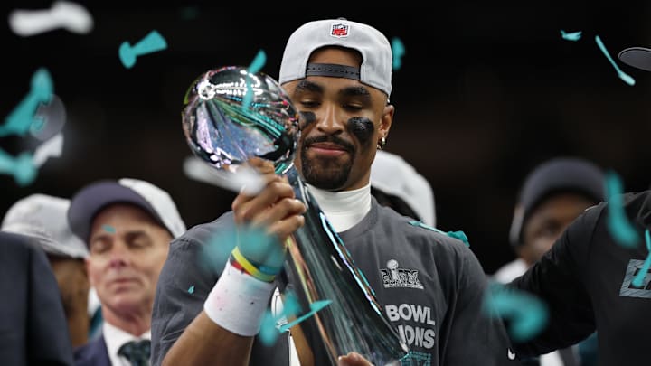 Feb 9, 2025; New Orleans, LA, USA; Philadelphia Eagles quarterback Jalen Hurts holds the Lombardi Trophy during the championship trophy presentation after the Eagles' game against the Kansas City Chiefs in Super Bowl LIX at Caesars Superdome. Mandatory Credit: Geoff Burke-Imagn Images