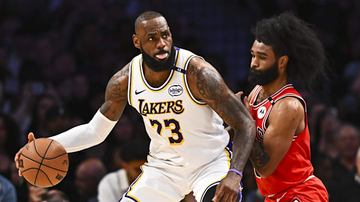 Mar 22, 2025; Los Angeles, California, USA; Los Angeles Lakers forward LeBron James (23) looks to pass against Chicago Bulls guard Coby White (0) during the second half at Crypto.com Arena. Mandatory Credit: Jonathan Hui-Imagn Images