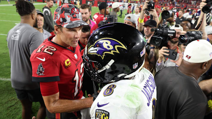 Oct 27, 2022; Tampa, Florida, USA;  Tampa Bay Buccaneers quarterback Tom Brady (12) greets Baltimore Ravens quarterback Lamar Jackson (8) after a game at Raymond James Stadium. Mandatory Credit: Nathan Ray Seebeck-Imagn Images