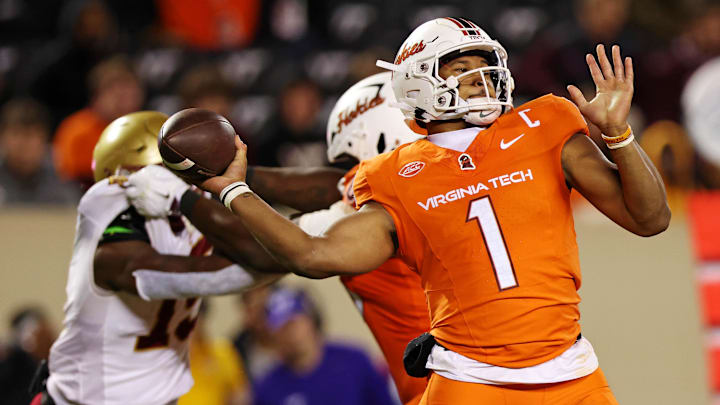 Oct 17, 2024; Blacksburg, Virginia, USA; Virginia Tech Hokies quarterback Kyron Drones (1) throws a pass during the third quarter against the Boston College Eagles at Lane Stadium. Mandatory Credit: Peter Casey-Imagn Images Oct 17, 2024; Blacksburg, Virginia, USA; Virginia Tech Hokies quarterback Kyron Drones (1) throws a pass during the third quarter against the Boston College Eagles at Lane Stadium. Mandatory Credit: Peter Casey-Imagn Images
