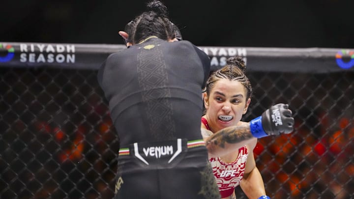 Sep 14, 2024; Las Vegas, Nevada, USA; Irene Aldana of Mexico (red gloves) fights Norma Dumont of Brazil (blue gloves) during Riyadh Season Noche UFC 306 at The Sphere. 