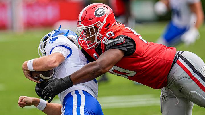 Oct 4, 2025; Athens, Georgia, USA; Georgia Bulldogs defensive lineman Elijah Griffin (90) chases and tackles Kentucky Wildcats quarterback Cutter Boley (8) at Sanford Stadium. Mandatory Credit: Dale Zanine-Imagn Images
