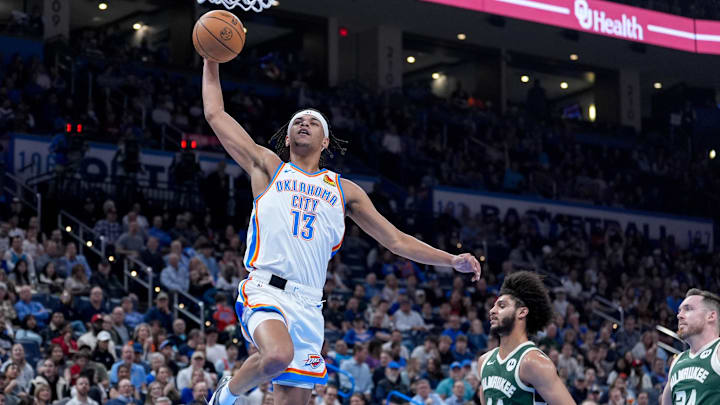 Oklahoma City forward Ousmane Dieng (13) dunks the ball in the second quarter during an NBA game between Oklahoma City and Milwaukee at the Paycom Center in Oklahoma City on Monday, Feb. 3, 2025.