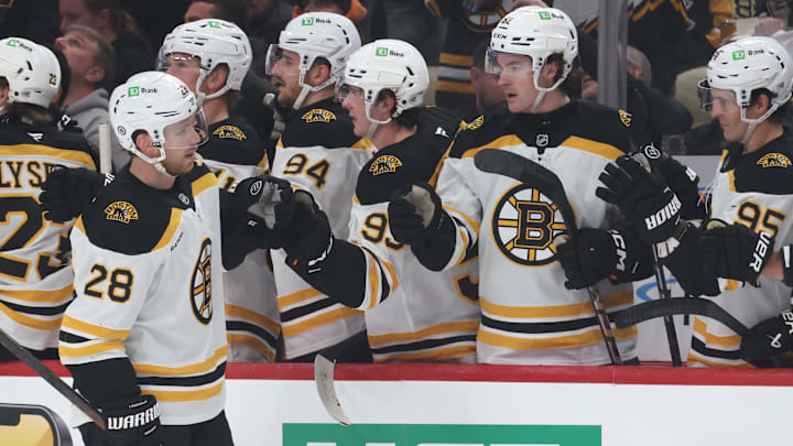 Apr 13, 2025; Pittsburgh, Pennsylvania, USA;  Boston Bruins center Elias Lindholm (28) celebrates his goal with the Boston bench against the Pittsburgh Penguins during the first period at PPG Paints Arena. Mandatory Credit: Charles LeClaire-Imagn Images